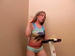 Busty blonde Haley Scott enjoys fingering her snatch in a gym