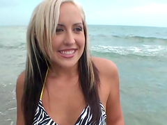 Pretty Madison Minx relaxes on a beach and rides a dick
