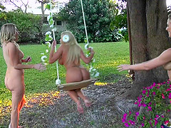 Three blonde cuties lick each other's cunts in the garden