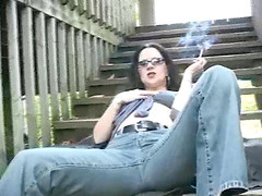 Stylish woman smokes and masturbates in open