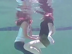 Two kinky lesbians get to finger one another in the pool