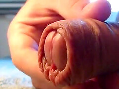 a close-up video of me playing with my foreskin.