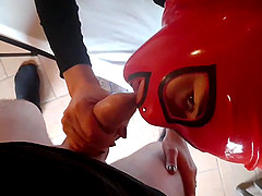 Kinky girl with a red mask and high heels knows how to please a dick