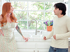The red-haired beauty Sophia Locke fucks away with her man in the kitchen.