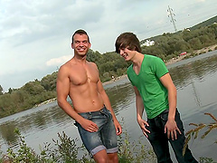 A twink and his well-built BF enjoy having sex by the pond