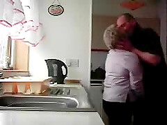 Chubby granny gets fondled in the kitchen by her hubby