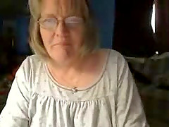 Chubby granny shows her big natural tits and shaved vag for the webcam