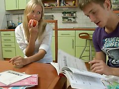 Teen cutie do her homework with her classmate.