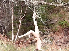 Naked self-bondage in the woods gone wrong.