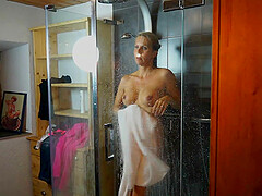 Mature blonde housewife Julia Pink strips and takes a shower